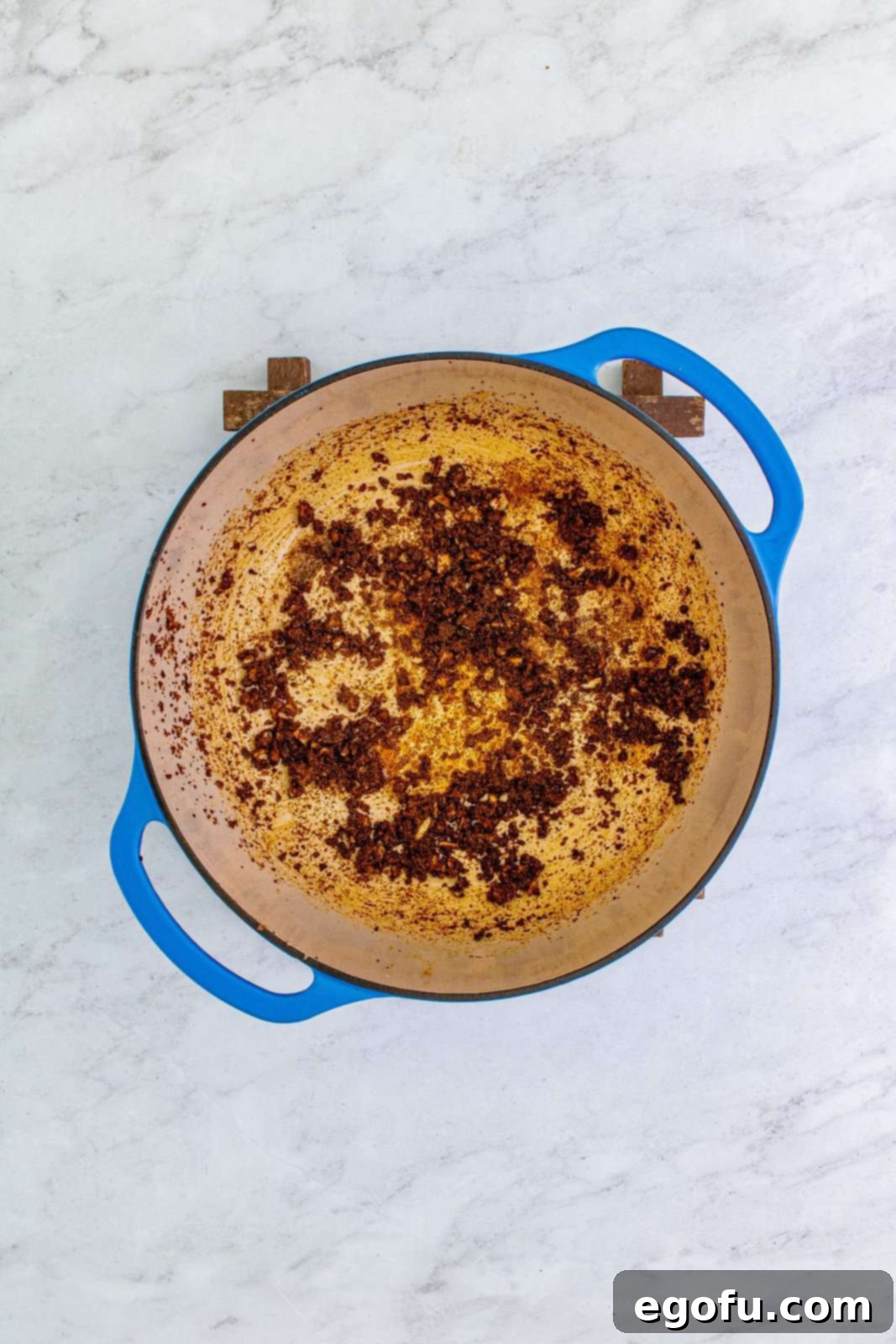 Southwest Chicken Enchilada Bowl 7 Garlic, chili powder, cumin, onion powder and salt added to dutch oven.