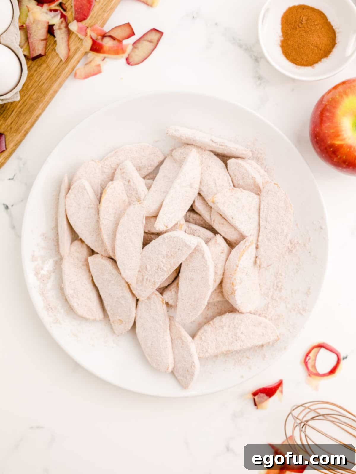 Coated apples placed on plate.