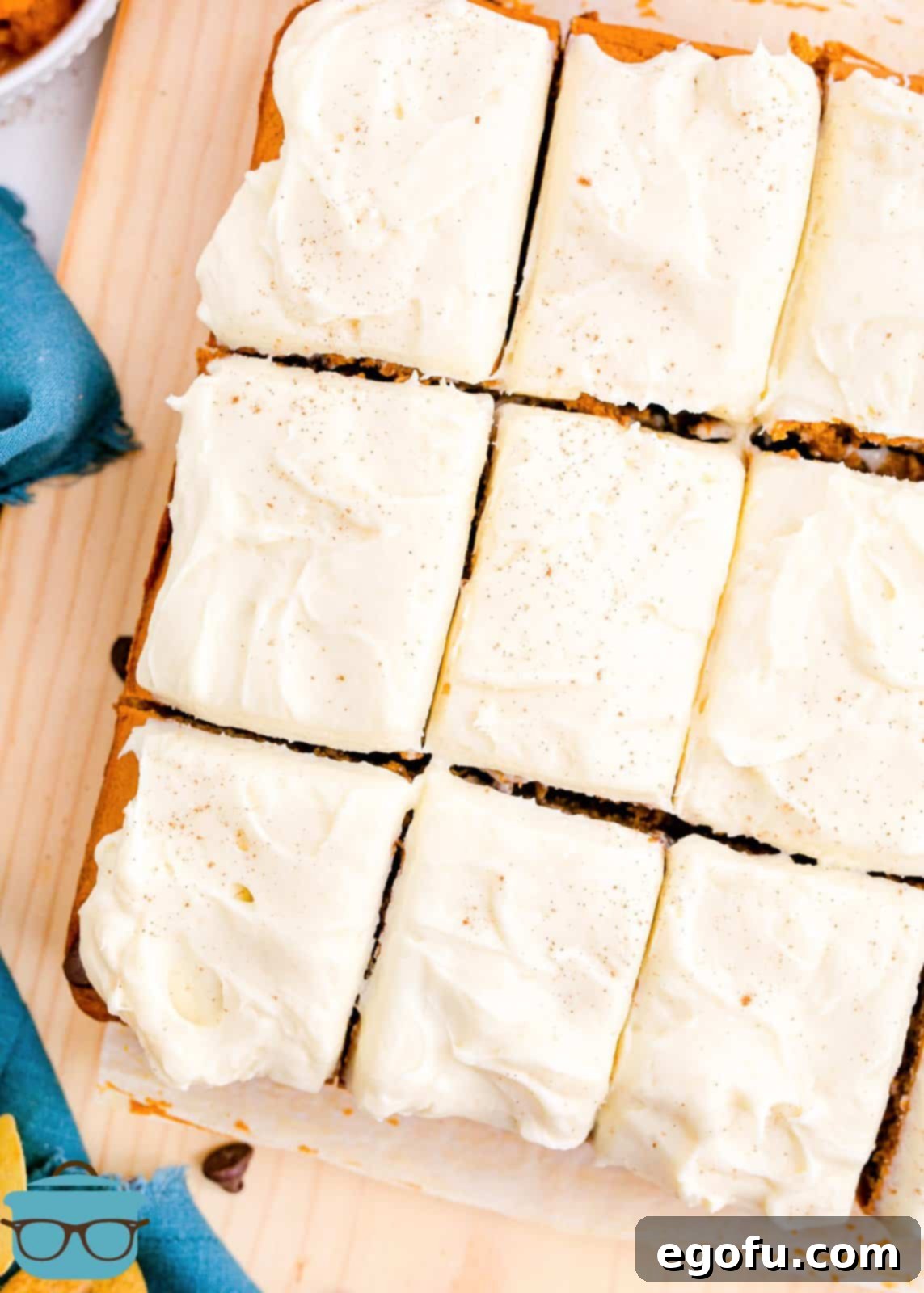 Overhead of Pumpkin Chocolate Chip Cake sliced showing frosting.