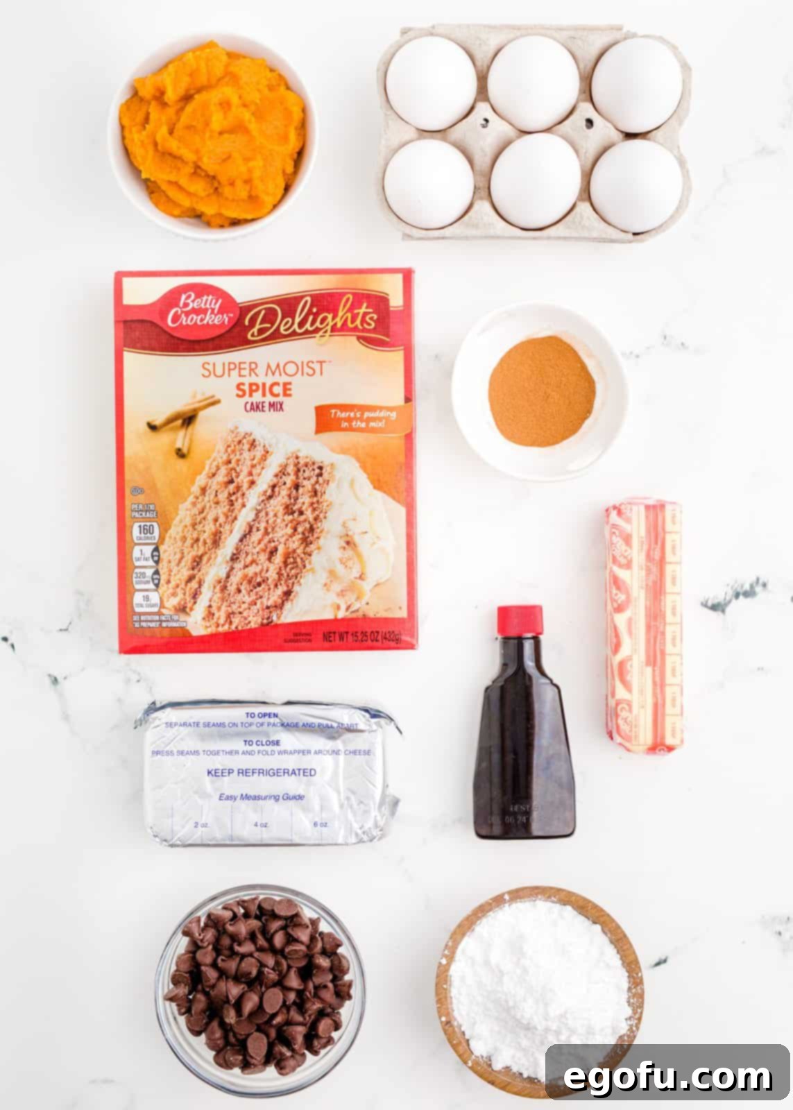 Ingredients needed: spice cake mix, pumpkin puree, cinnamon, eggs, cream cheese, salted butter, vanilla extract, powdered sugar and semi-sweet chocolate chips.
