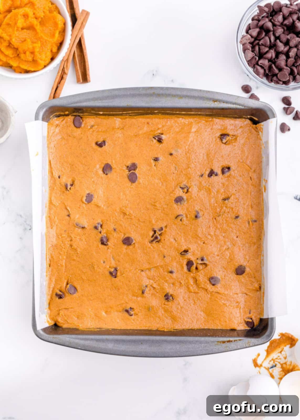 Cake batter spread into prepared pan.