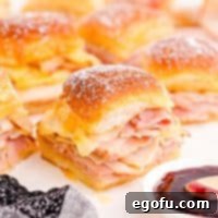 Close up square image of Monte Cristo Sliders with jam.