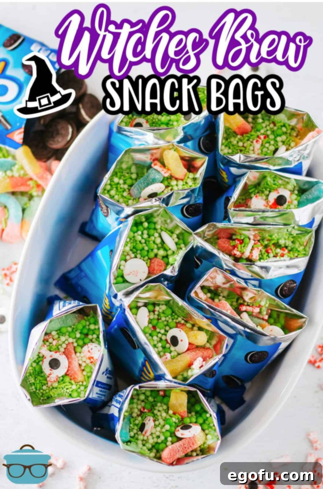 Pinterest-optimized image showcasing finished Witches Brew Snack Bags beautifully arranged in a white serving dish.