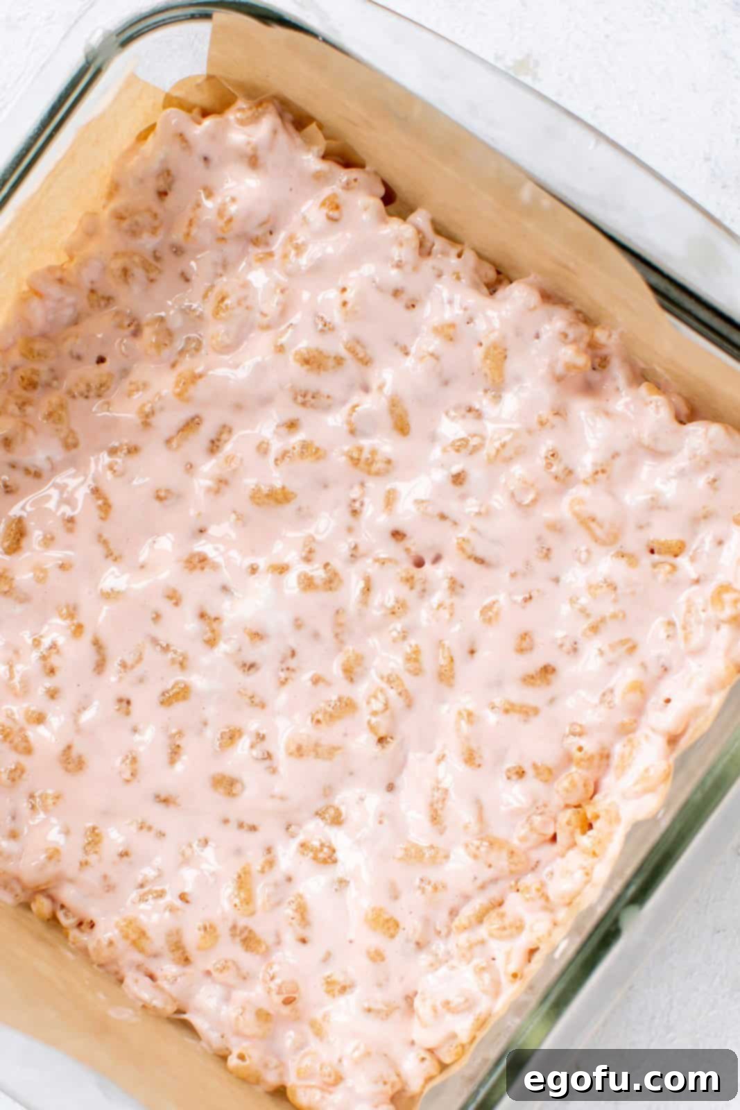 Creepy Crispy Critters 7 Rice Krispies mixture pressed into prepared pan.