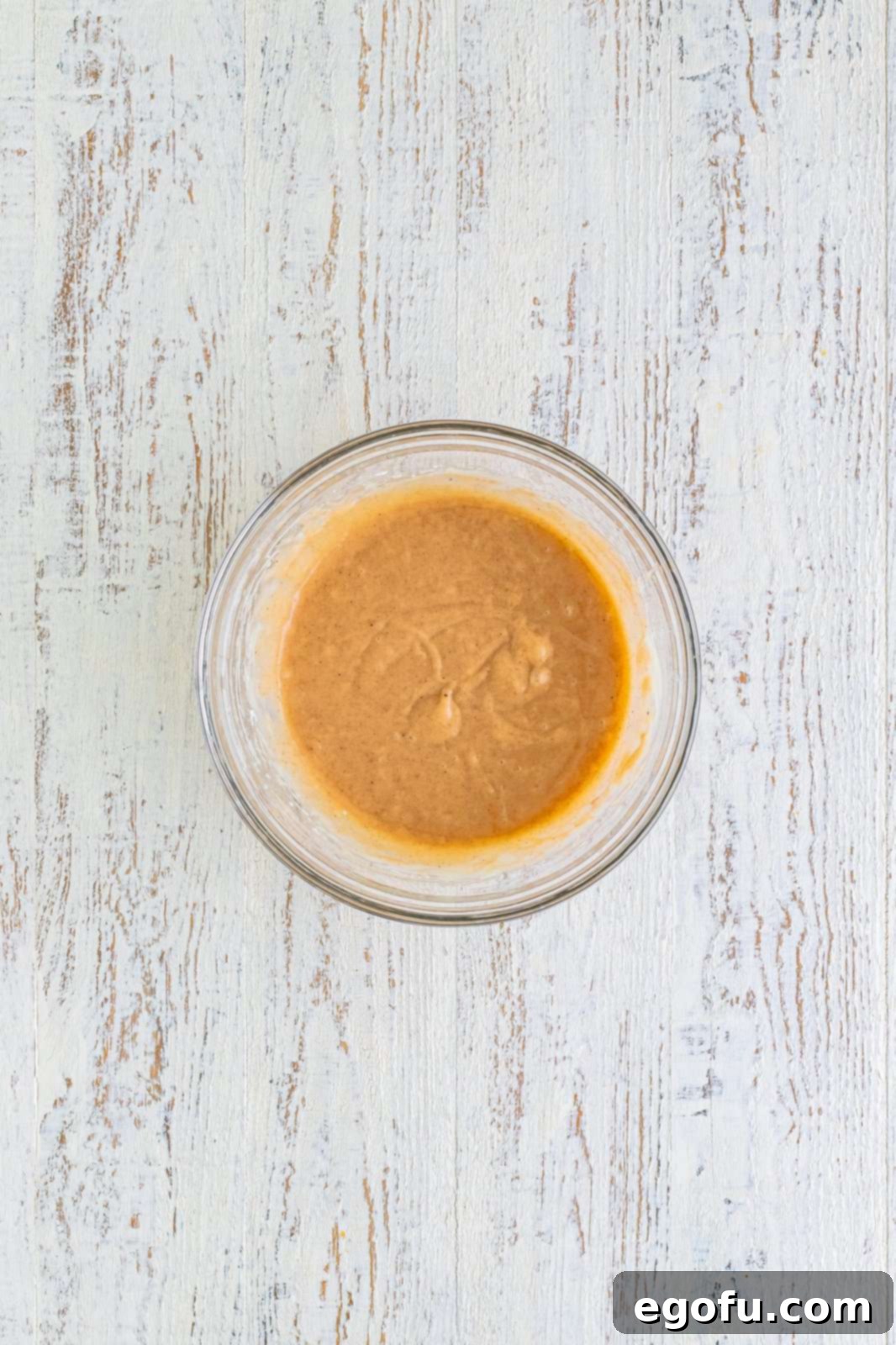 Melted butter, powdered sugar and pumpkin pie spice mixed into the cream cheese filling.