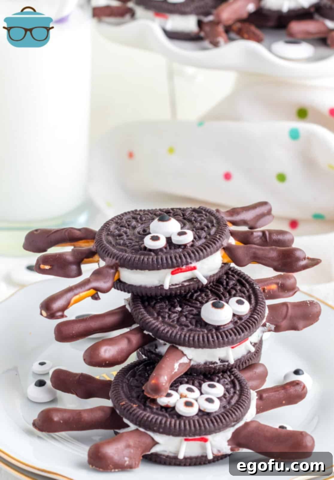 Spooktacular Oreo Spiders 12 Stacked Halloween Oreo Spiders on white plate showing the fangs.
