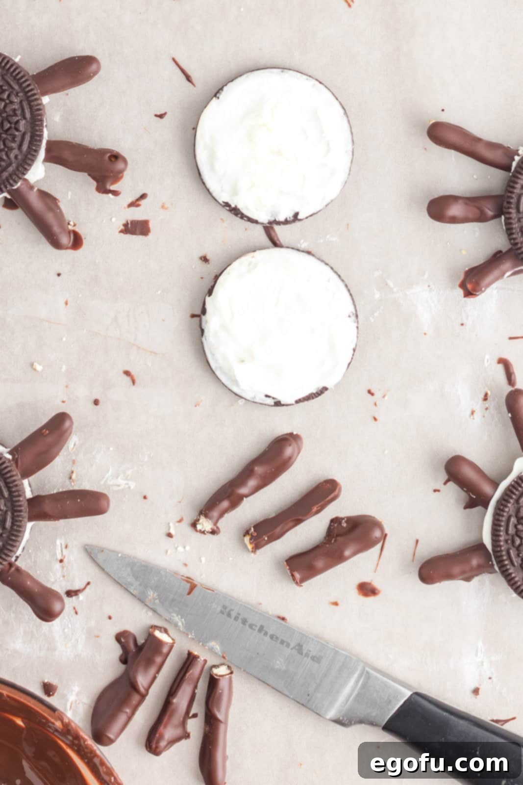 Spooktacular Oreo Spiders 8 Oreo cut in half with pretzels cut in half.