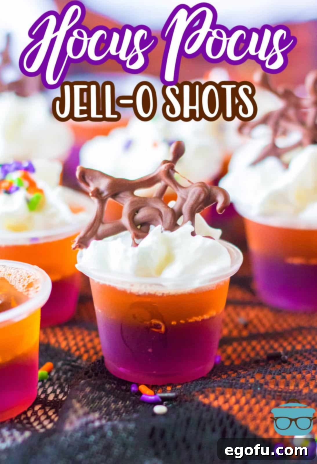 A Pinterest-ready image of beautifully decorated Hocus Pocus Jell-O Shots, arranged on black lace, highlighting their festive appeal.