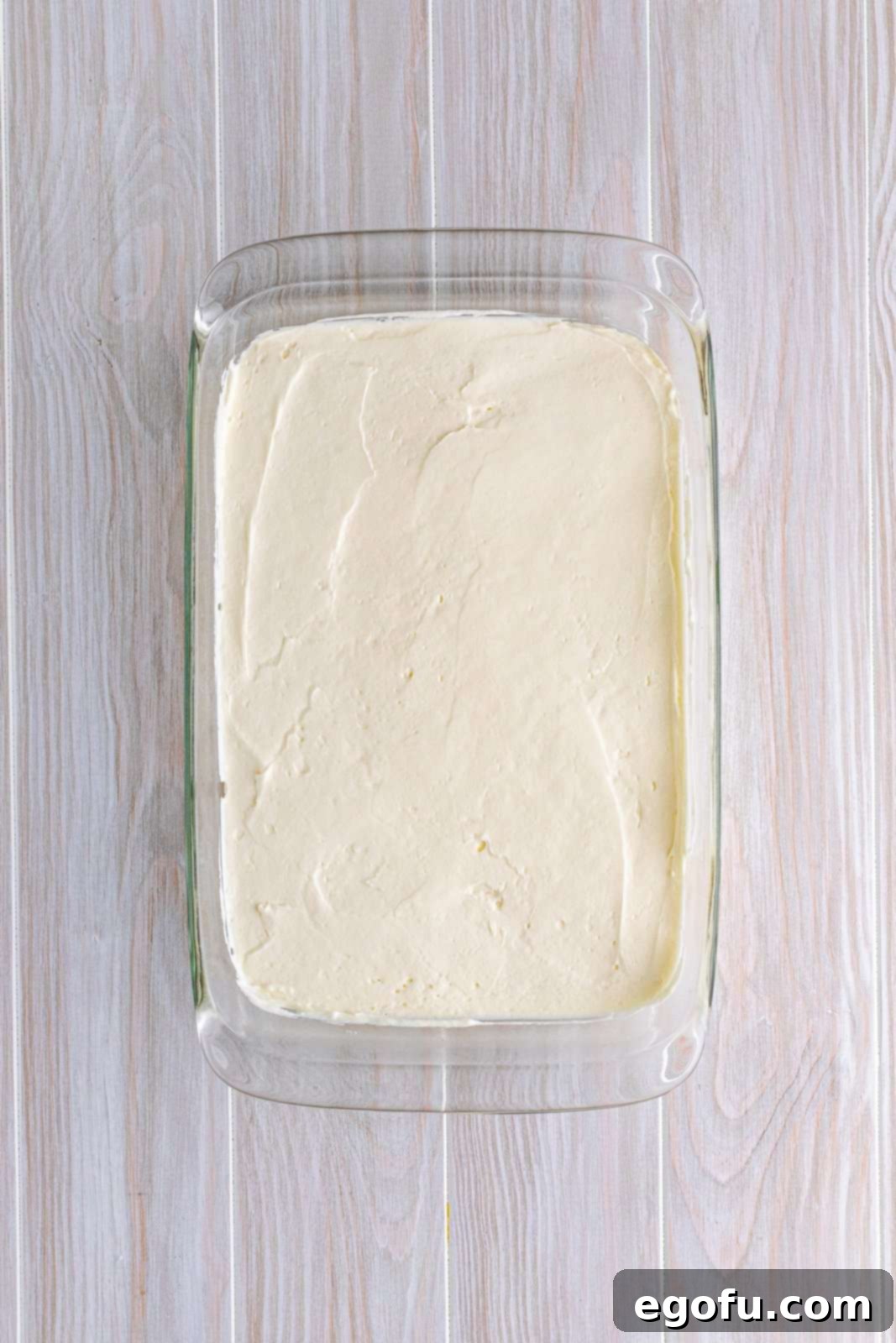 Cream cheese mixture spread over crust.