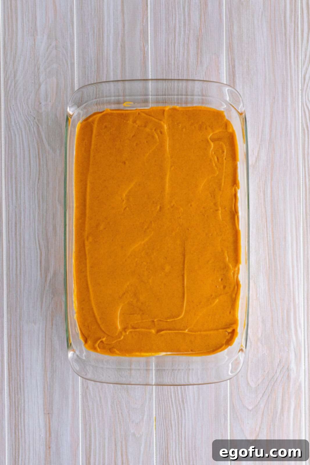 Pudding mixture spread over cream cheese mixture in pan.