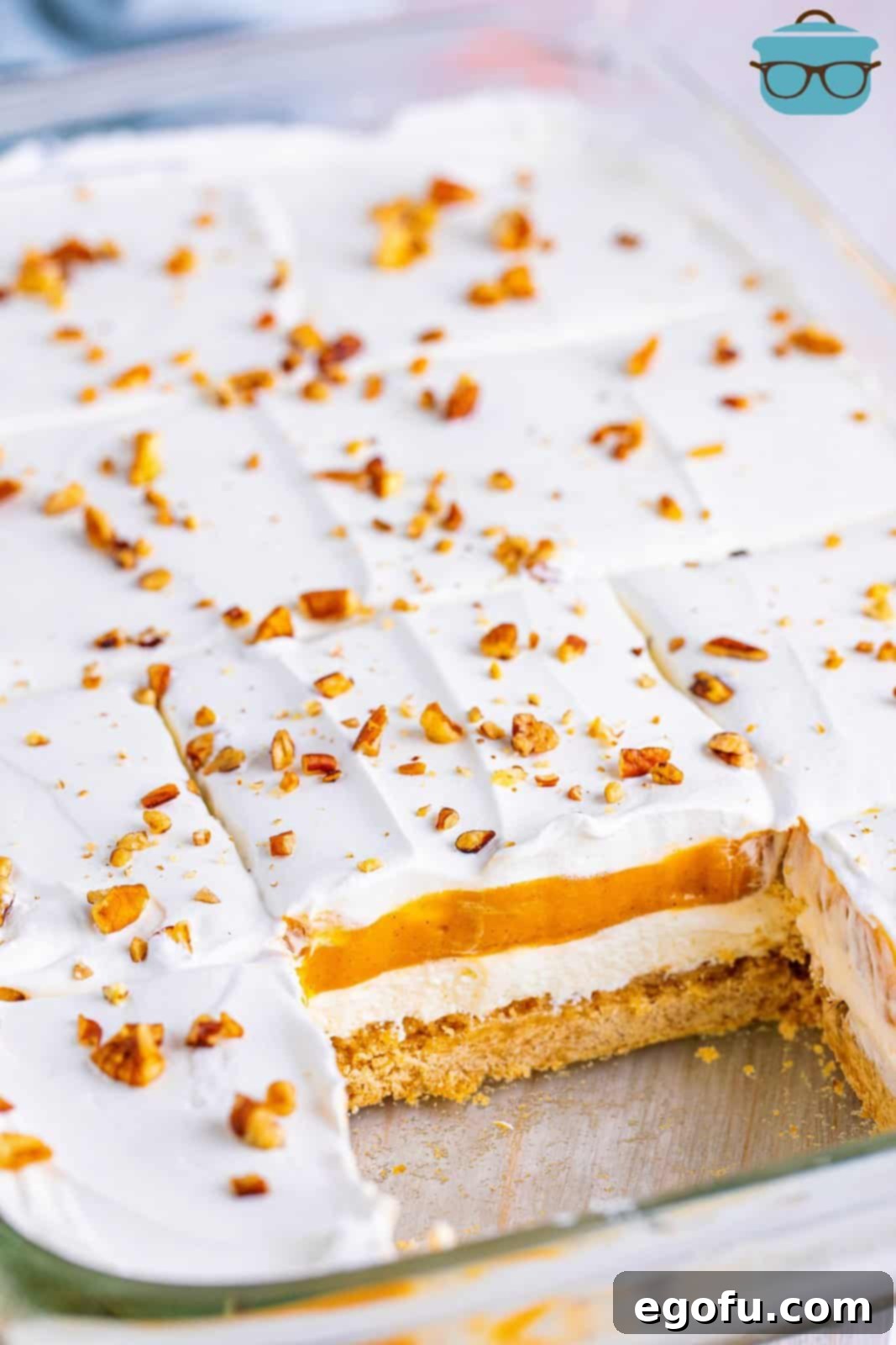 Pan of Pumpkin Delight with slice taken out showing layers.