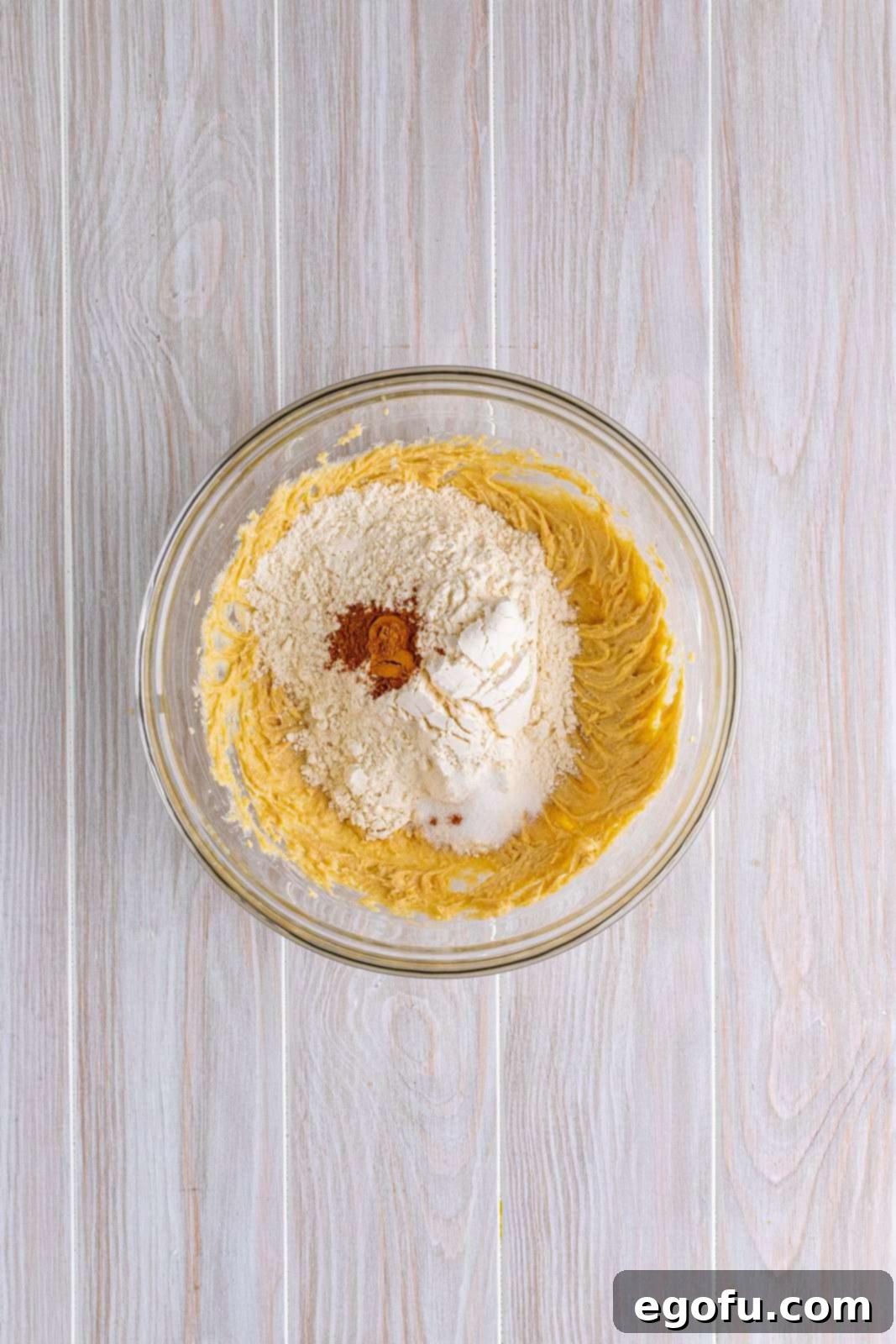 Flour, and pumpkin spice added to the brown sugar and butter mixture.