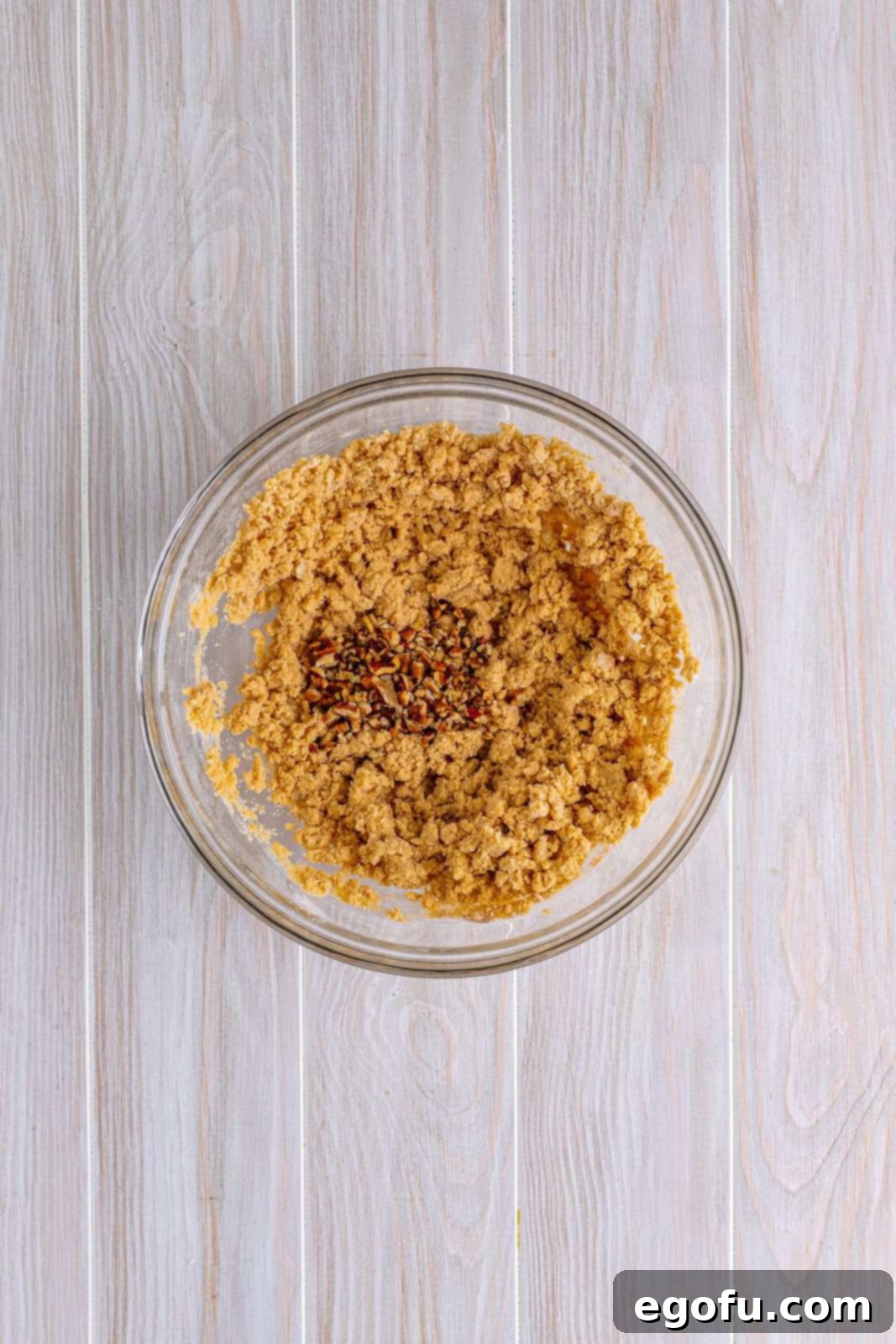 Pecans added to the butter, flour and brown sugar mixture.