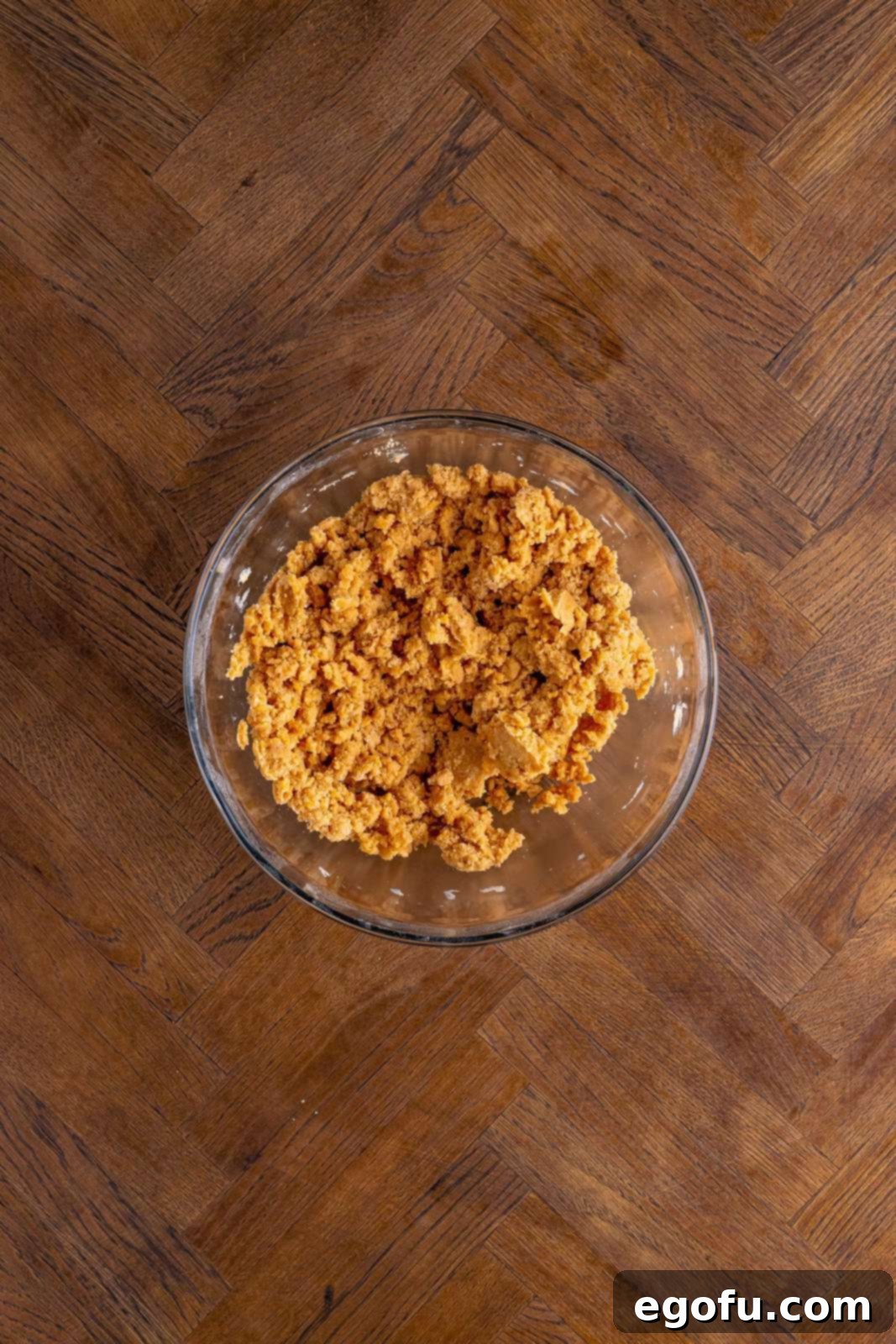 Classic Apple Crumble Bars 9 The egg and vanilla have been thoroughly mixed into the flour and butter mixture, transforming it into a cohesive and uniform crumb, ready for pressing.