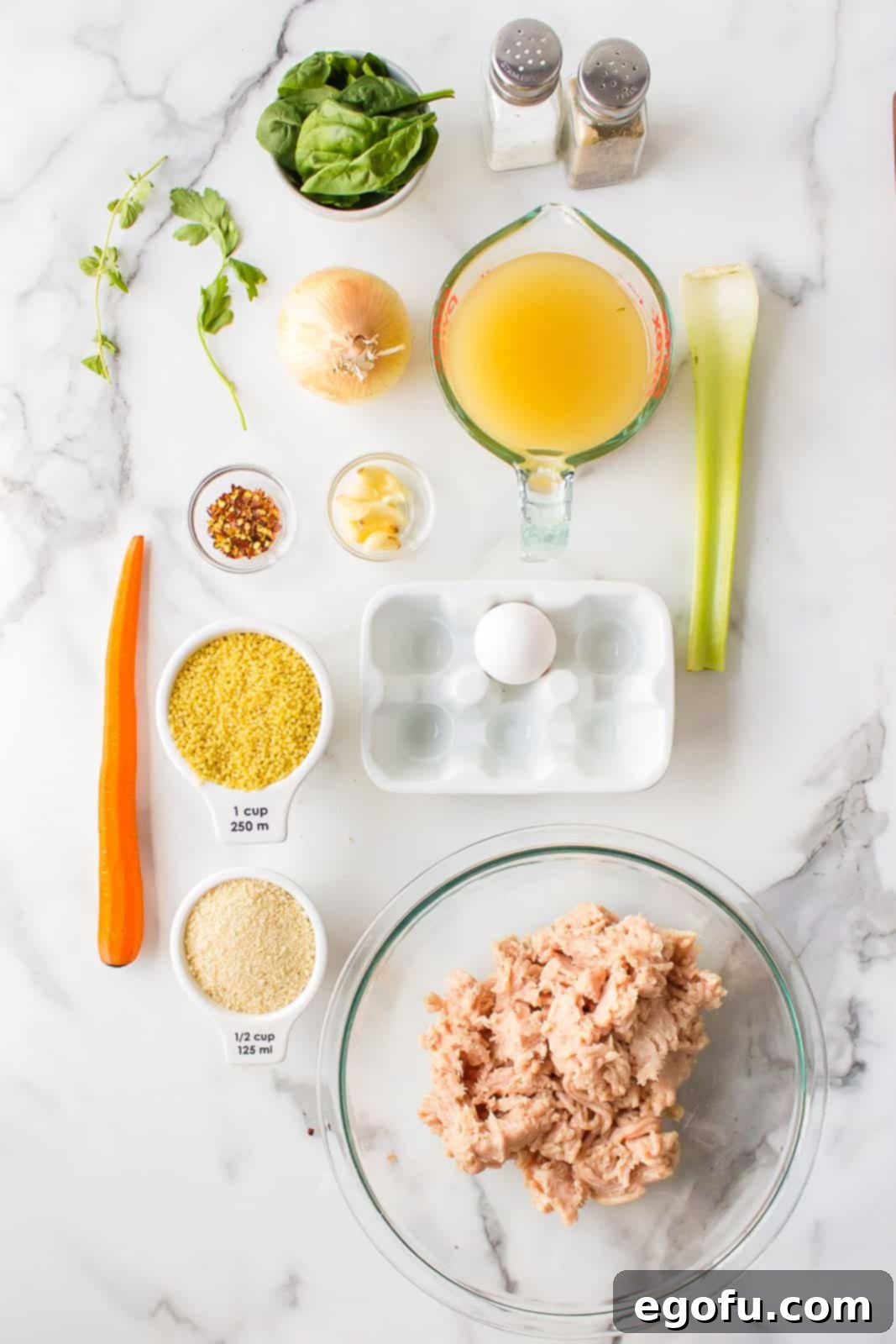 Italian Celebration Soup 4 Ingredients needed: ground chicken, egg, fresh parsley, fresh oregano, kosher salt, pepper, garlic, Italian breadcrumbs, chicken broth, celery stalks, carrots, sweet onion, salt, red pepper flakes, Acini de Pepe pasta and spinach.