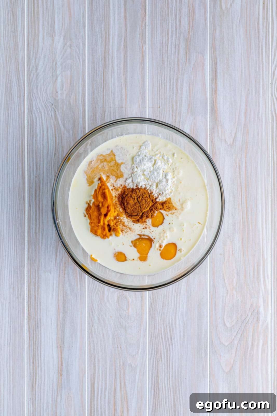 Pie filling ingredients added to a bowl.