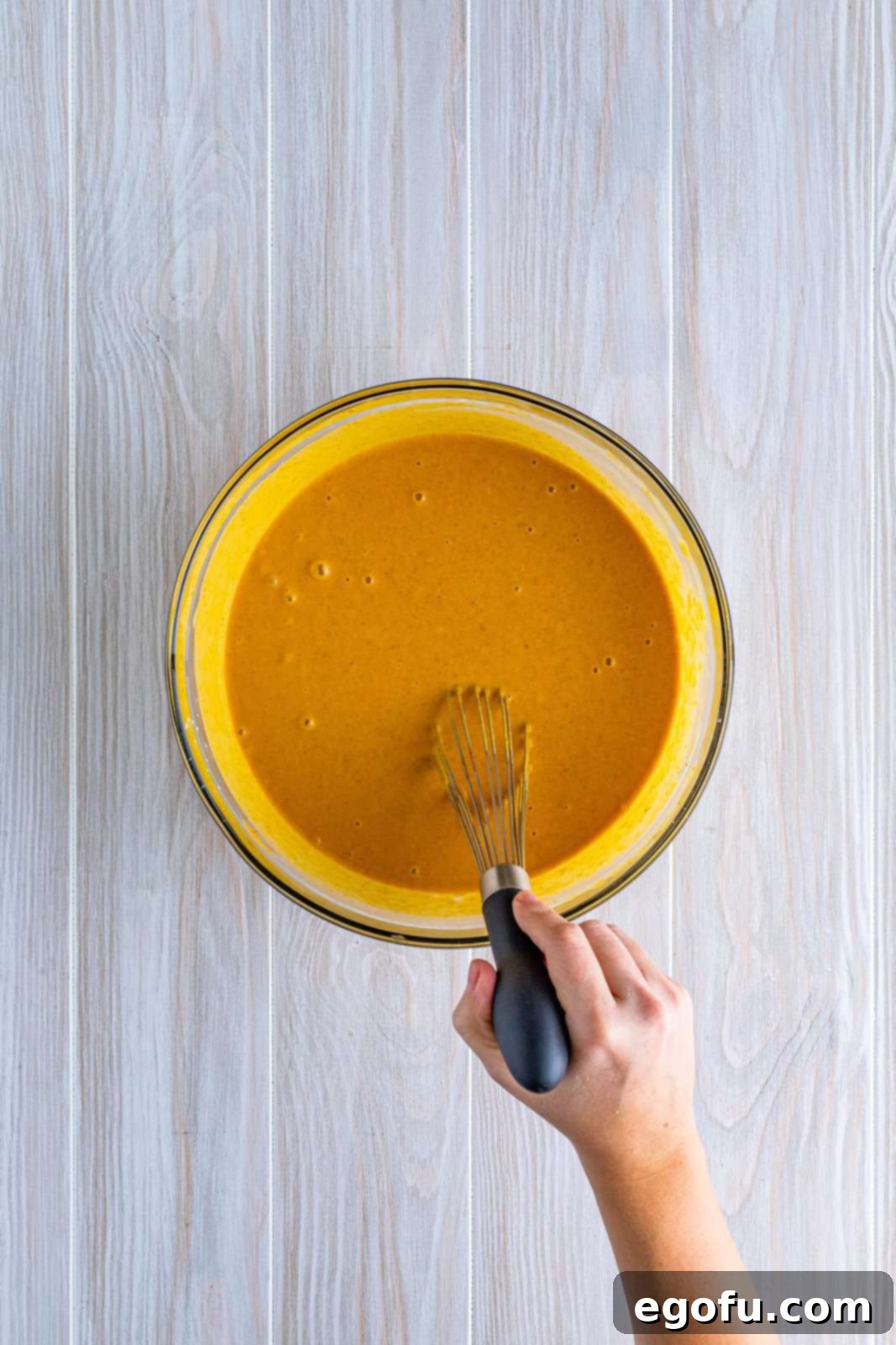 Filling ingredients whisked together in bowl.