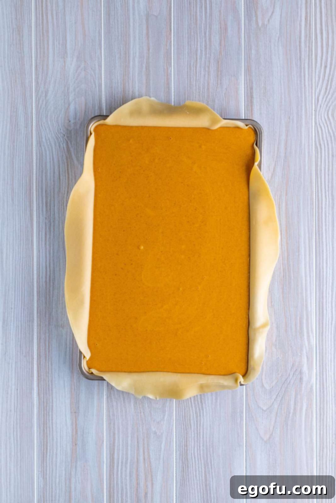 Filling poured into the bottom pie crust.