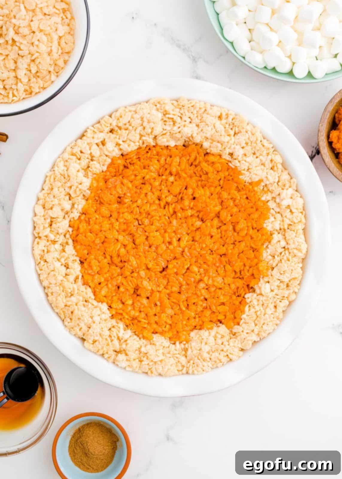 Pie filling pressed into the center of the rim in the pie plate.