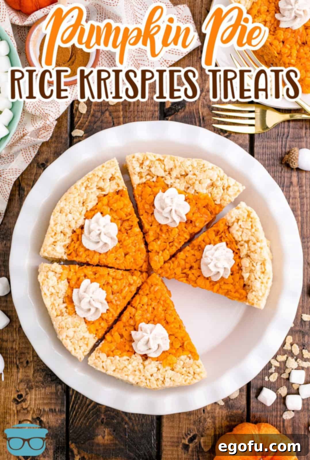 Overhead of Pumpkin Pie Rice Krispies Treats in pie plate with slices missing topped with cinnamon whipped cream Pinterest image.