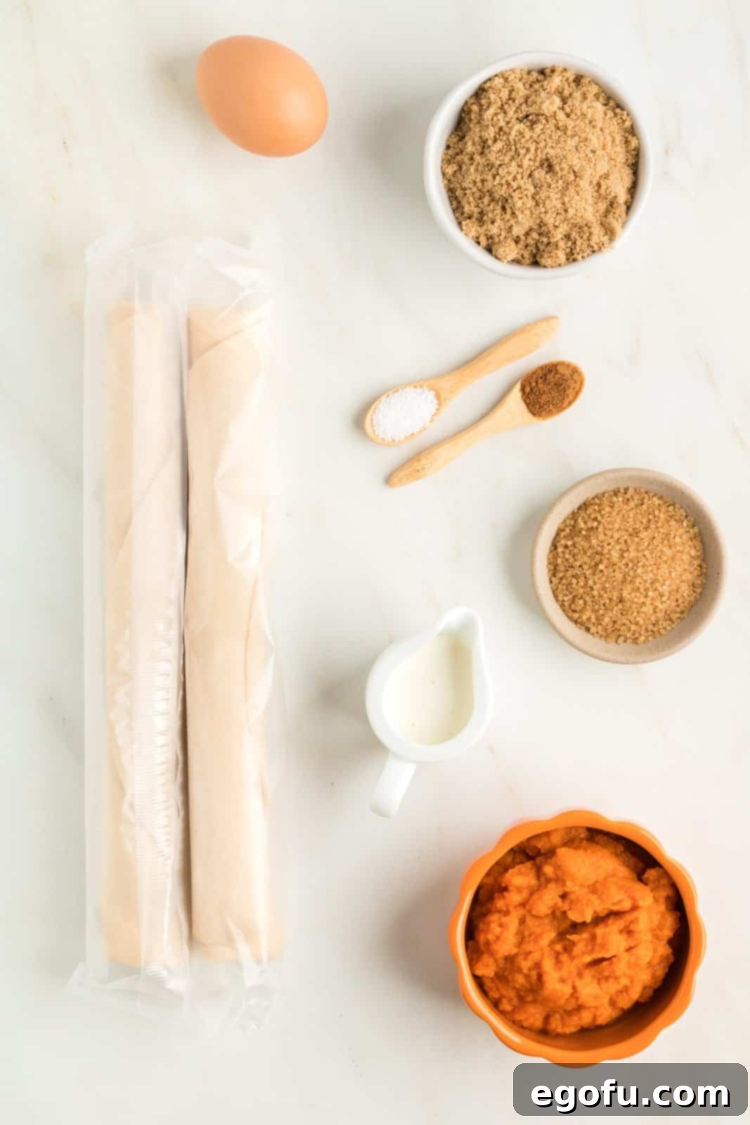 Ingredients needed: refrigerated pie crust, pumpkin puree, light brown sugar, heavy cream, pumpkin pie spice, salt, egg and coarse sugar.