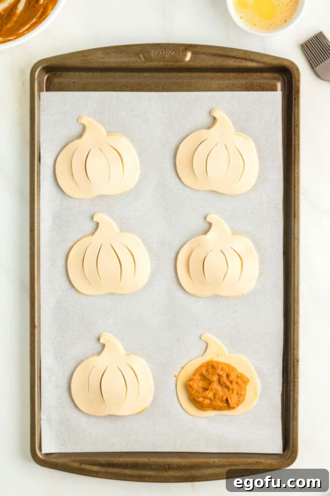 Tops of pie crust cut outs placed over pie filling with slits cut in them.