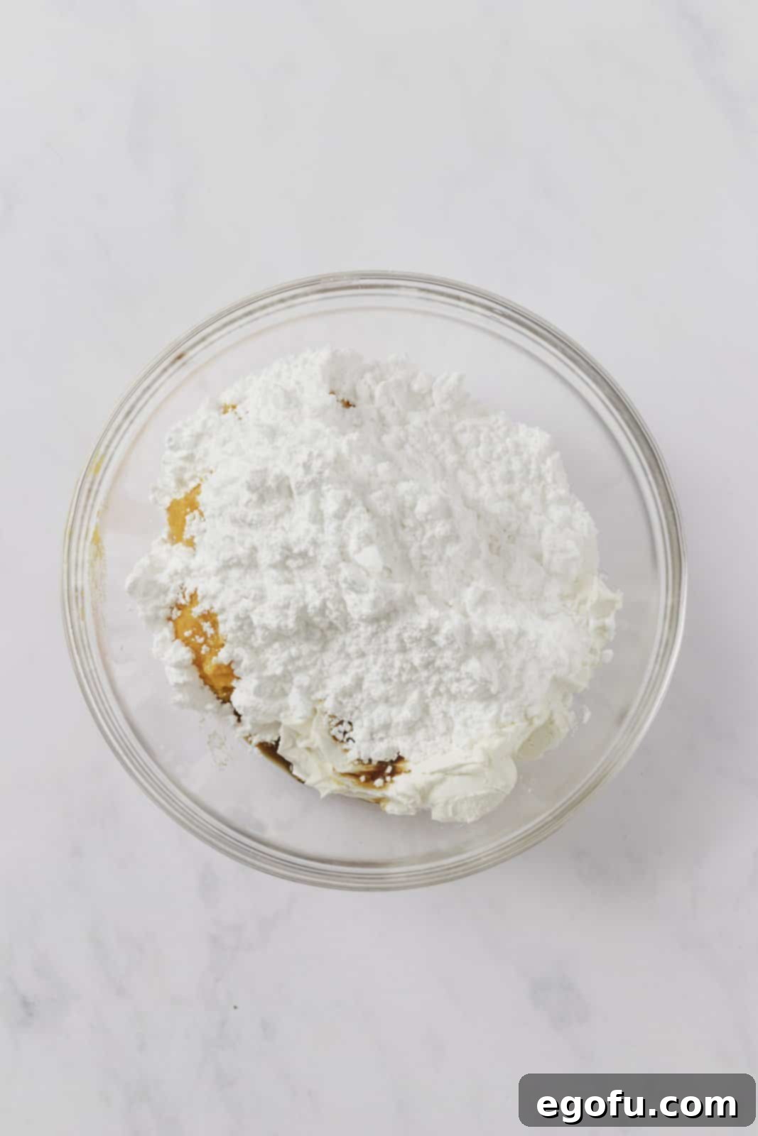 Dip ingredients added to clear bowl.