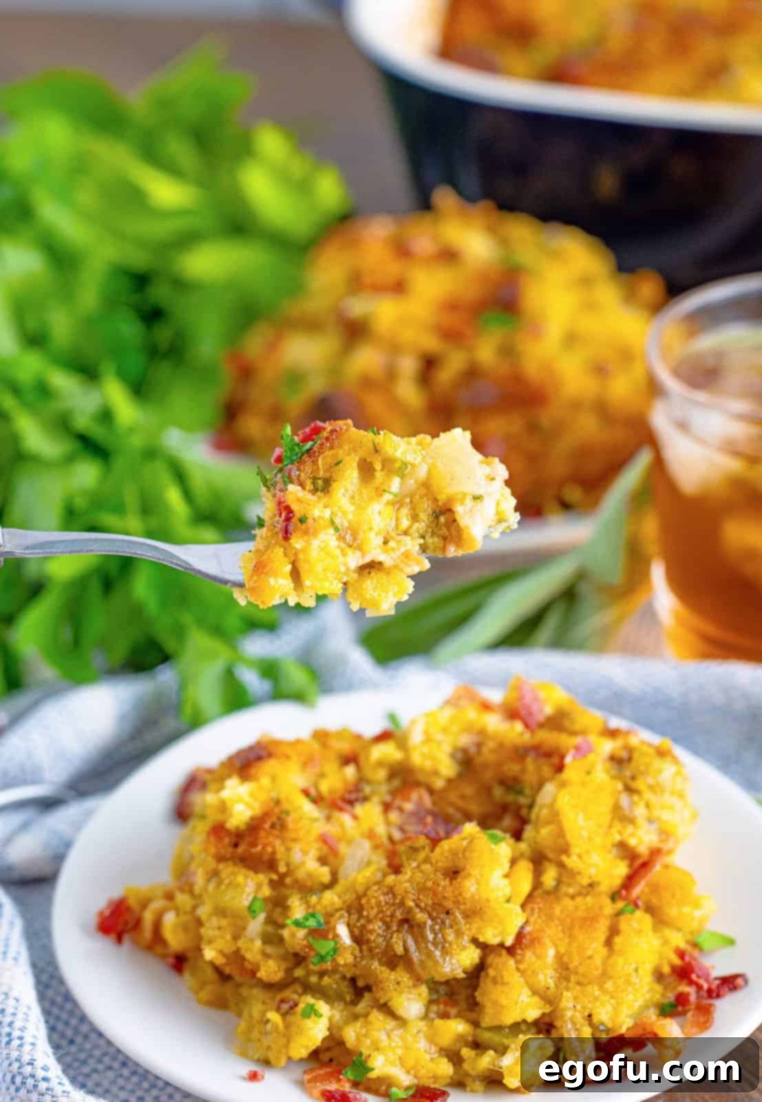 Fork holding up a bite of the Southern Cornbread Dressing.