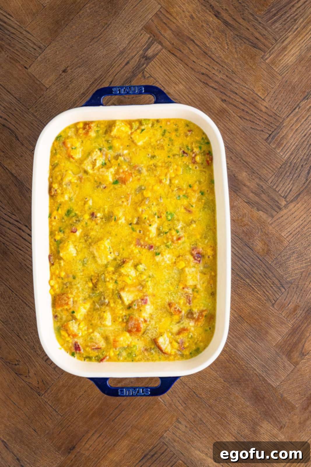 Dressing ingredients added to baking pan.