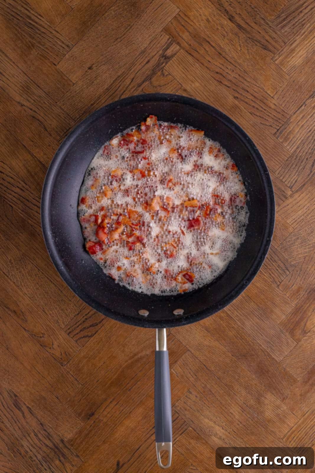 Bacon frying in pan.
