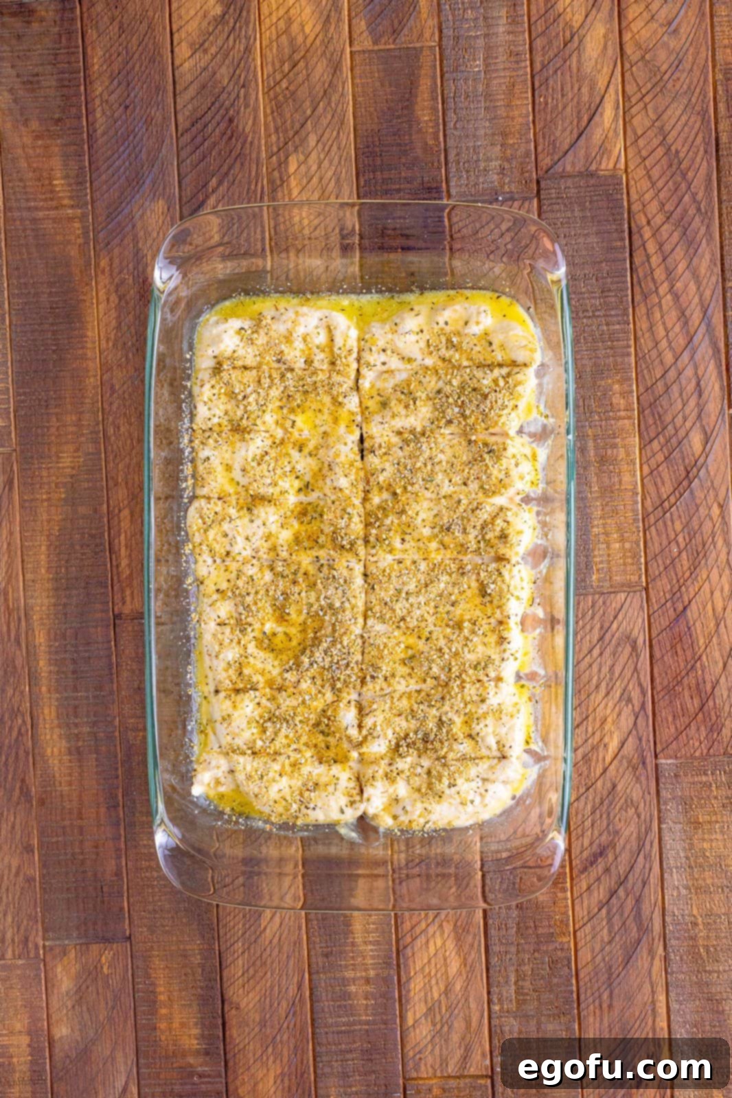 Pizza Hut's Signature Breadsticks 10 Pizza dough cut into sticks in pan.