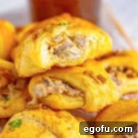 Close up square image of stacked French Dip Crescent Puffs.