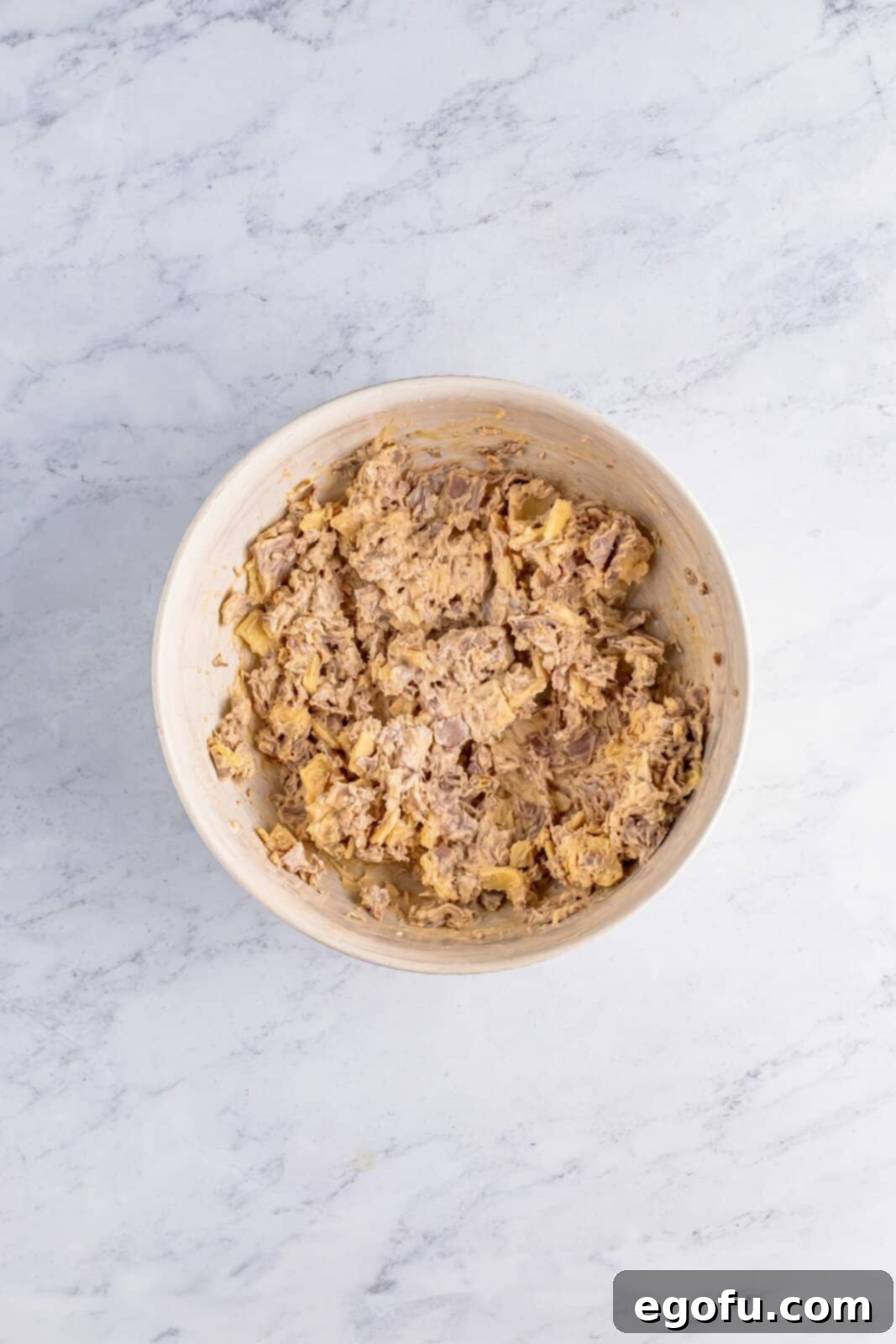 Roast beef mixture mixed together in bowl.