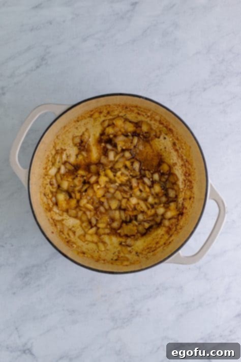 Down South Black Eyed Peas 13 Seasonings stirred into onions in dutch oven.