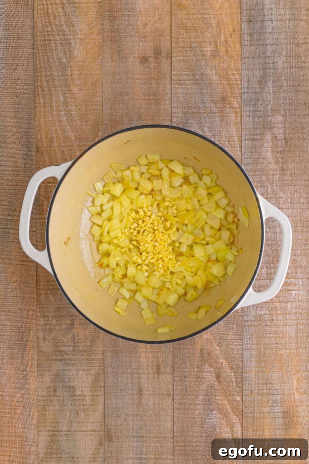 Onions sautéing in dutch oven.