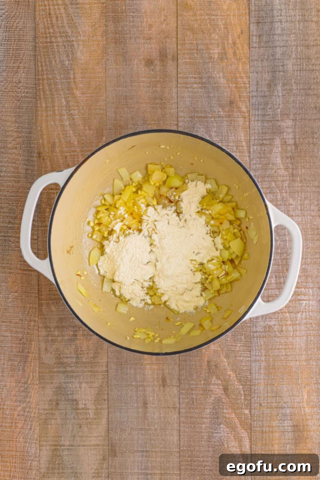 Flour added to onions in dutch oven.