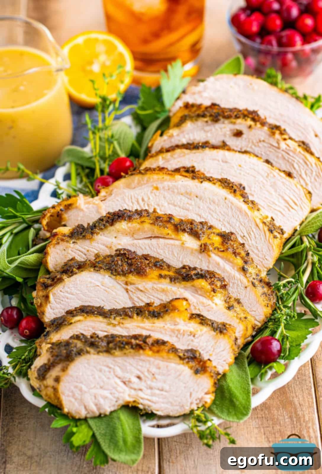 Perfectly sliced Slow Cooker Turkey Breast arranged on a platter with fresh greens, highlighting its succulent, juicy texture.