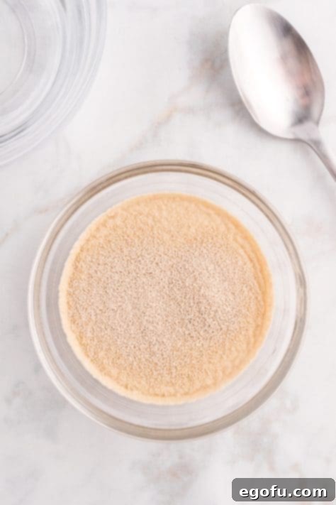 Yeast added to water in bowl.