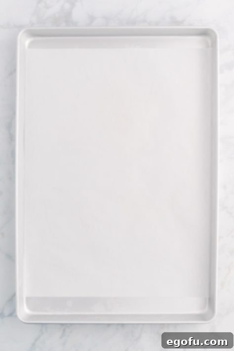 Baking sheet lined with parchment paper.