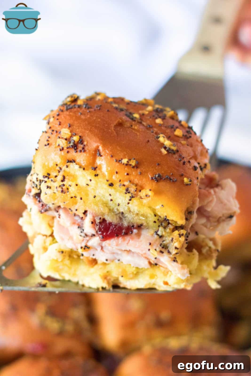 One of the Thanksgiving Leftovers Sliders being lifted up by metal server.