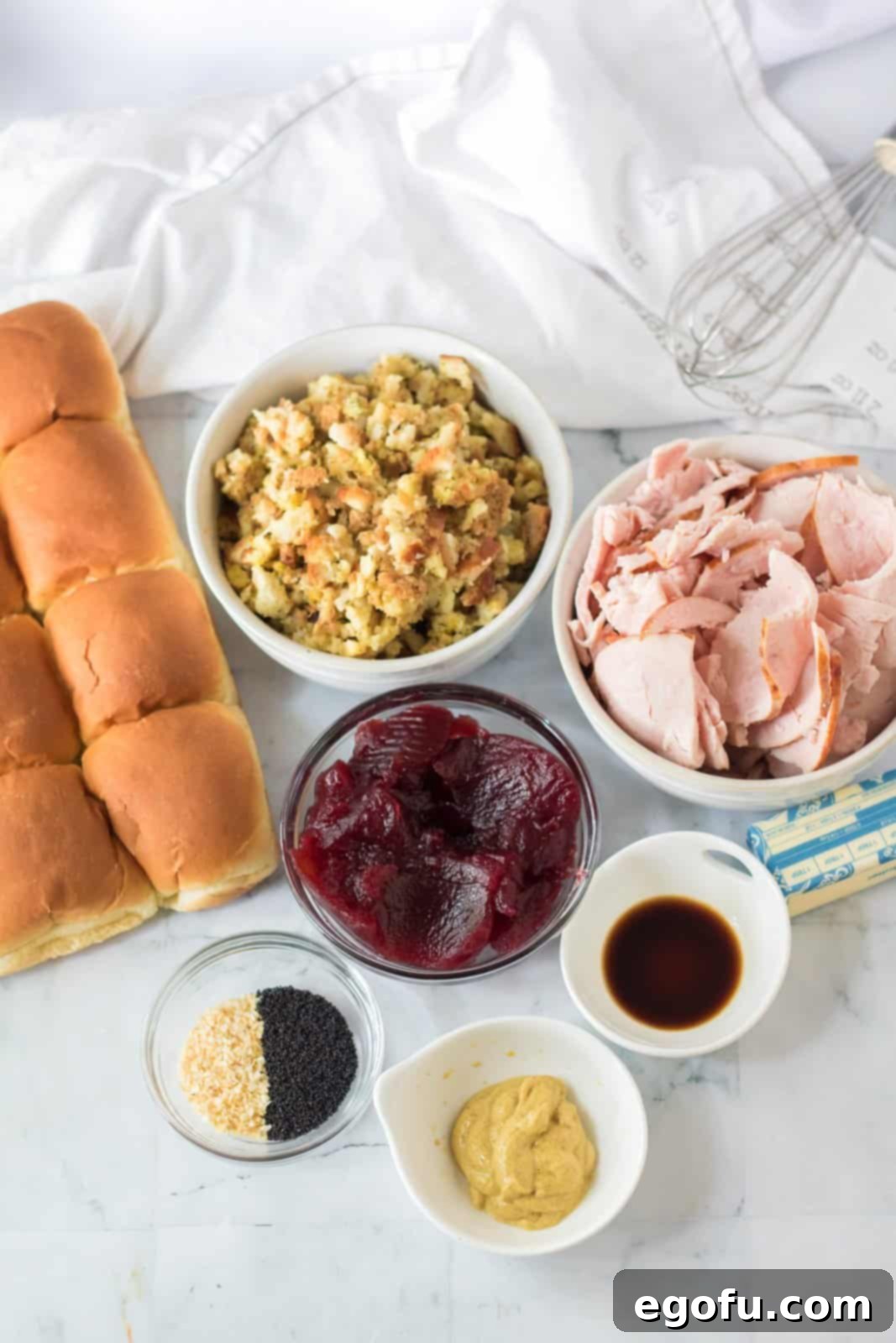 Ingredients needed: Hawaiian rolls, prepared stuffing mix, carved style deli turkey, or leftover turkey, cranberry sauce, dijon mustard, salted butter, worcestershire sauce, minced dried onions and poppy seeds.
