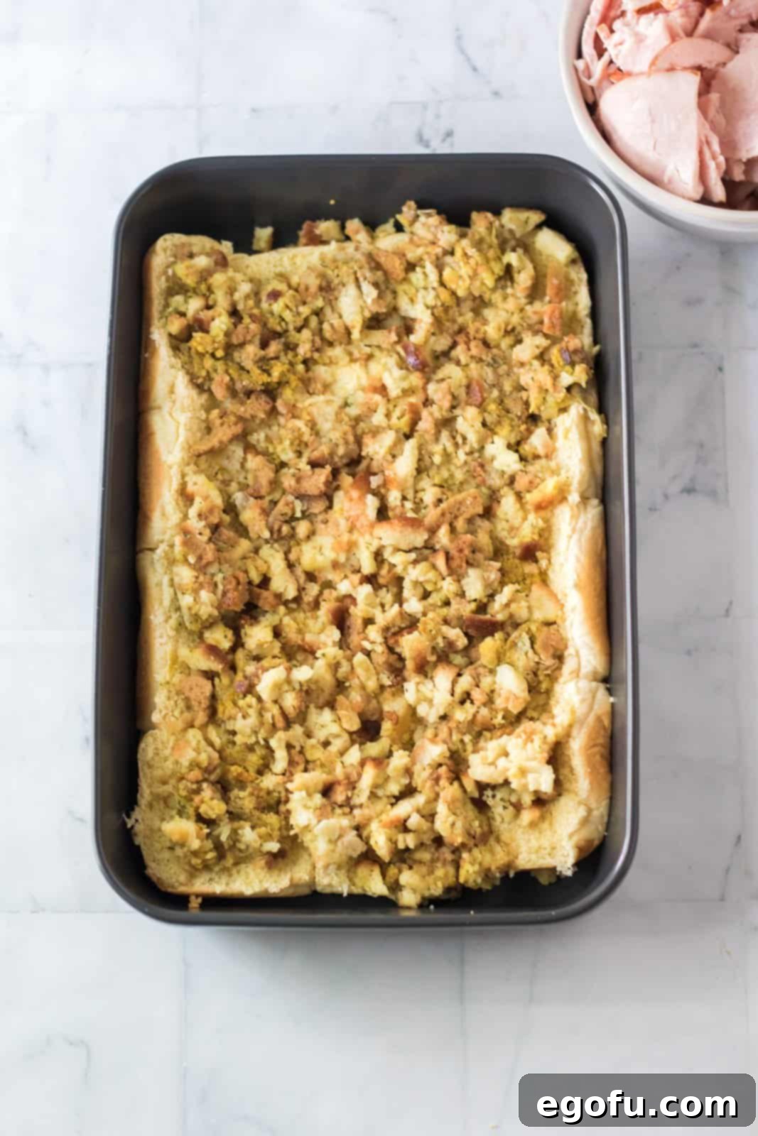 Stuffing spread over the top of the rolls.