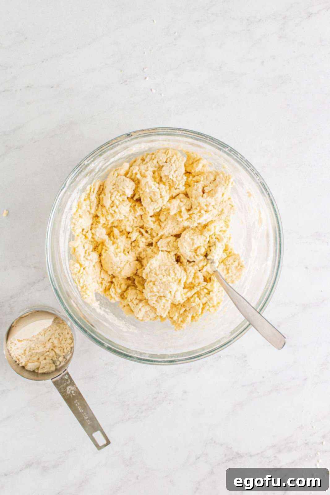 Hearty Turkey Pot Pie Delight 12 Buttermilk mixed into biscuit mixture making a dough.