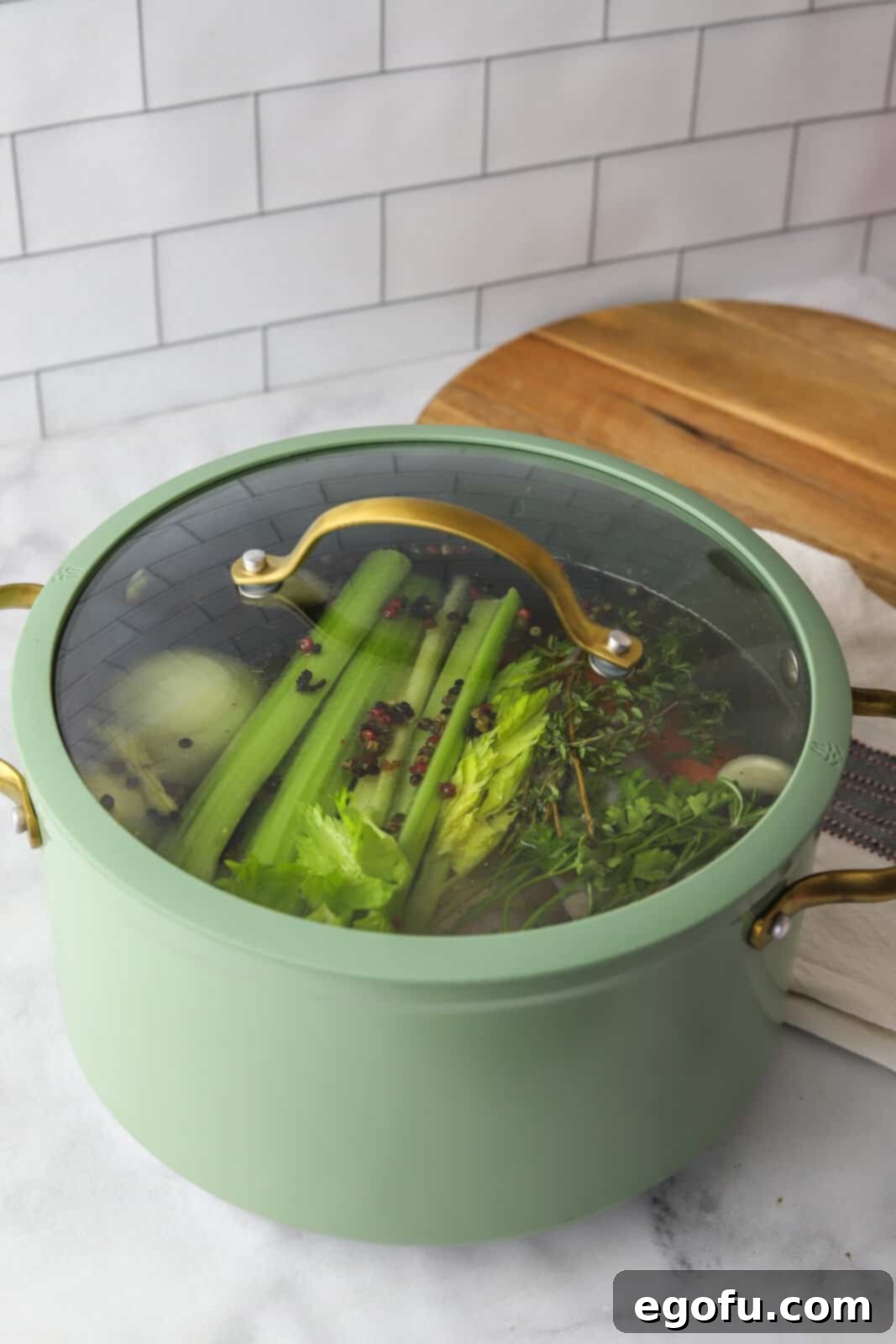 Cover added to stock pot while being cooked.