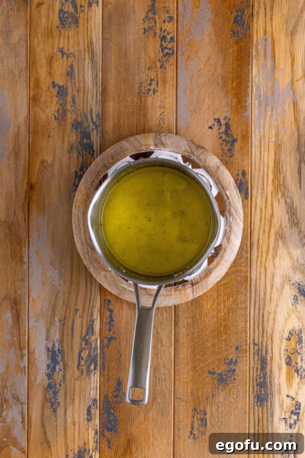 Melted butter, ranch dressing mix, Italian dressing mix, and sugar in saucepan.