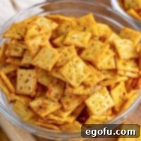 Close up square image of Seasoned Crackers in clear bowl.