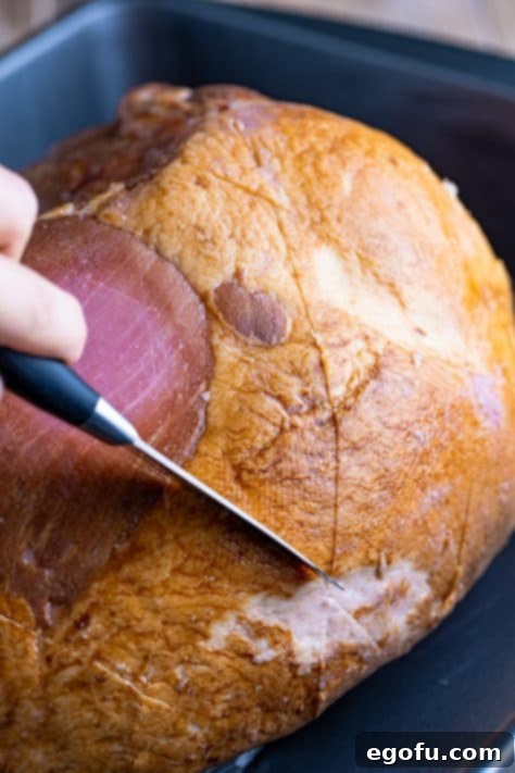 Mahogany Glazed Ham 18 Knife scoring ham.