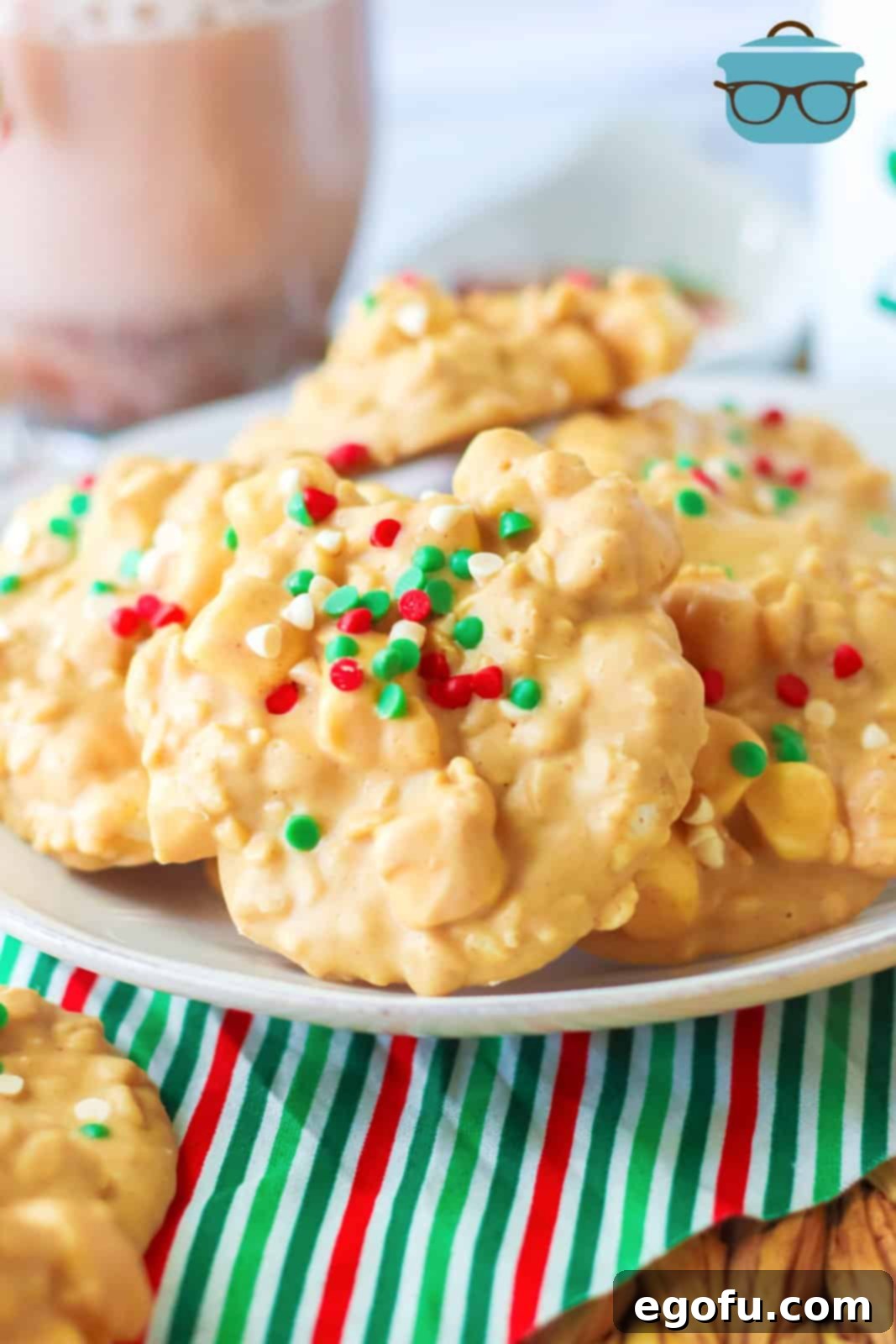 Crock Pot Avalanche Cookies stacked on a white plate, ready to be enjoyed.