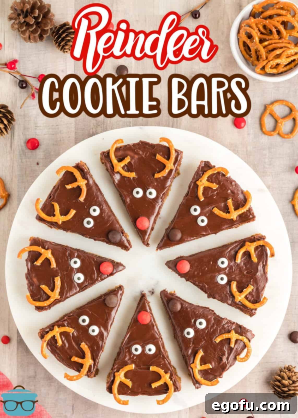 Overhead shot of freshly cut Reindeer Cookie Bars arranged neatly on a white platter, highlighting the individual portions and delicious chocolate frosting.