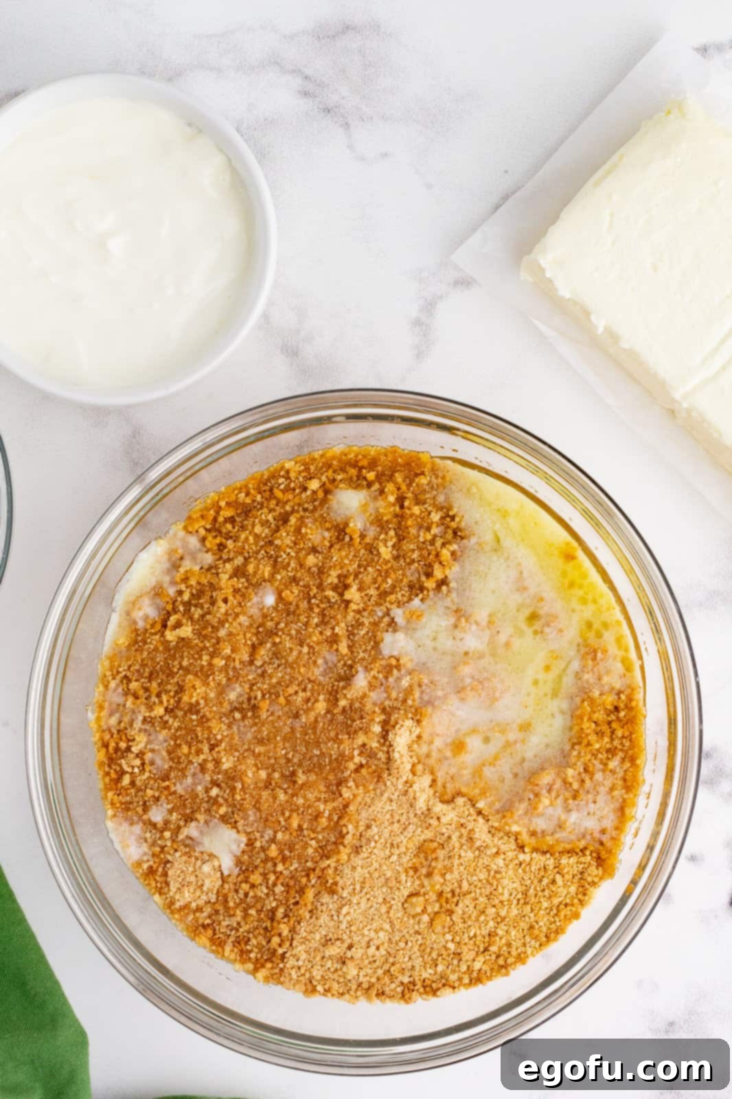 Jolly Santa Hat Cheesecakes 5 Crust ingredients in large bowl.